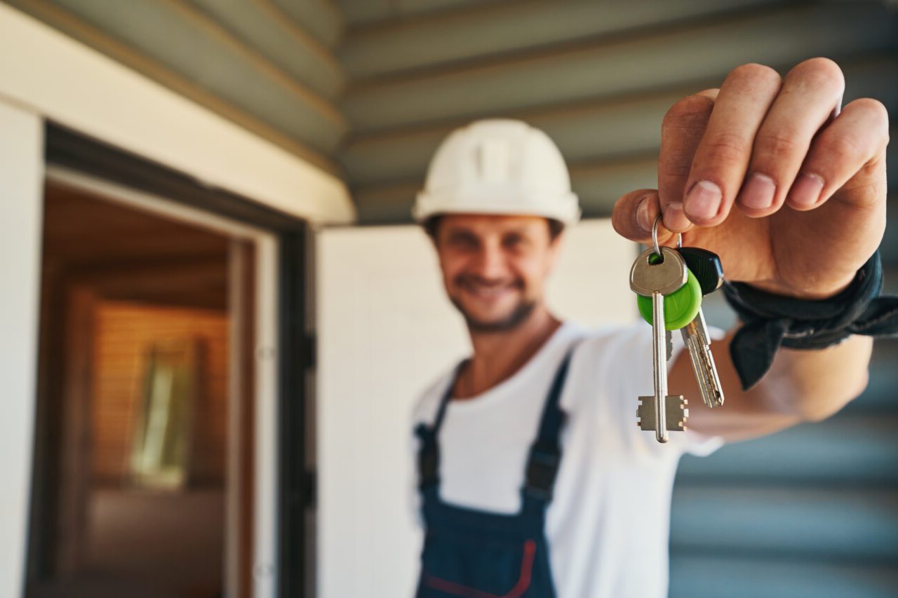 locksmith handing over new duplicated keys